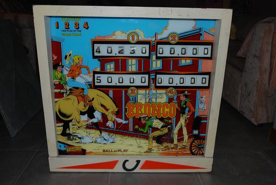 Bronco is an electro-mechanical pinball machine released by Gottlieb in 1977. It features horse and cowboy imagery, set against a western-themed backdrop.
