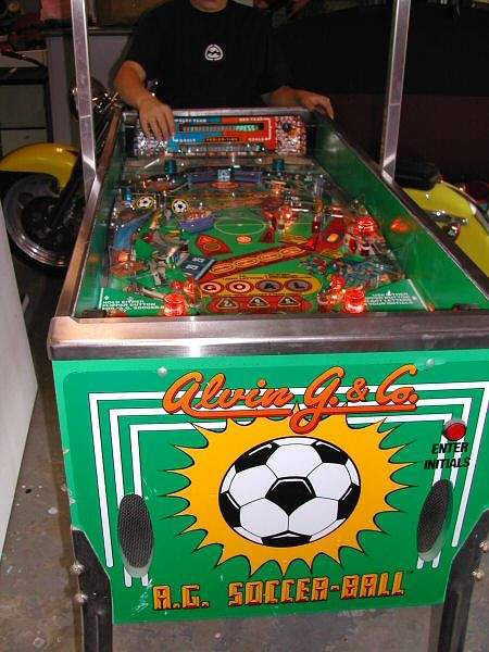 A.G. Soccer-Ball is a pinball machine that simulates a soccer game with flippers strategically placed to score goals. It features a competitive sports theme with team play options.