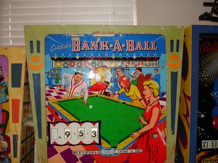 Bank-A-Ball is a classic pinball machine released by Gottlieb in 1965. This electromechanical machine is themed around billiards, featuring pool balls and related imagery.
