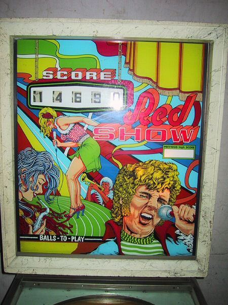 Red Show is a classic electromechanical pinball machine produced by Zaccaria in 1974. Known for its colorful circus-themed artwork and engaging playfield layout, this machine offers a nostalgic pinball experience.