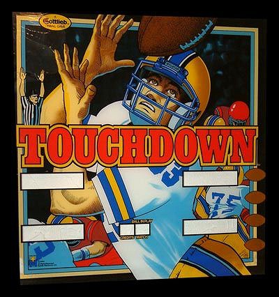 Touchdown is a pinball machine designed by Jon Norris and produced by D. Gottlieb & Co. in 1983. The game is themed around American football and features vibrant graphics and gameplay mechanics reflective of the sport.