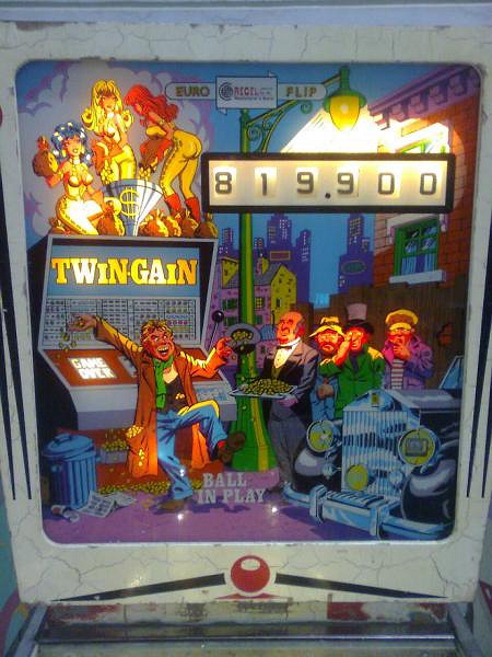 Twin-Gain is a pinball machine created by Recel in 1976. It features a classic electromechanical layout typical of this era.