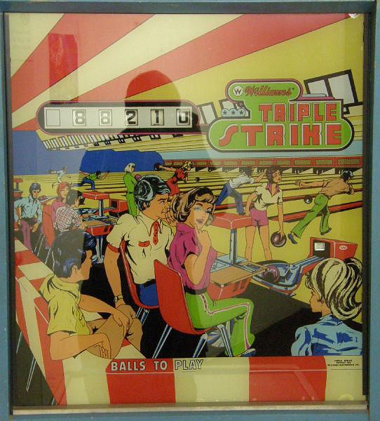 Triple Strike is a bowling-themed electro-mechanical pinball machine released by Williams in 1975. It features classic design and gameplay elements typical of the era.