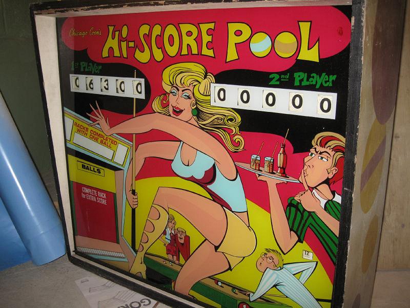 Hi-Score Pool is an electro-mechanical arcade game designed to simulate a pool game, produced by Chicago Coin in 1971. It features a realistic playfield with pool table graphics and allows players to score points by achieving specific objectives in the game.