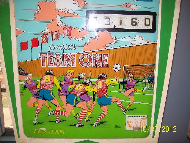 Team One is a classic electro-mechanical pinball machine designed by Ed Krynski and released by Gottlieb in 1977. It features an engaging sports theme reminiscent of Gottlieb's earlier game, 'Abra Ca Dabra'.