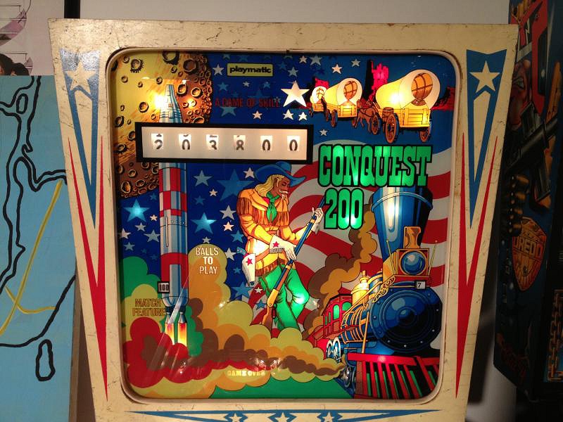 Conquest 200 is a pinball machine released by Playmatic in 1975, known for its distinctive 1970s design and engaging gameplay.
