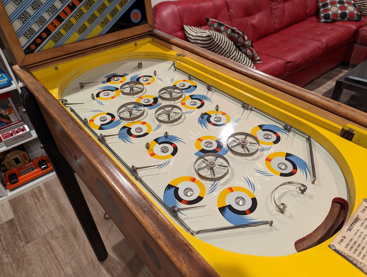 Buttons and Bows is a vintage pinball machine manufactured by Gottlieb in 1949. It features the traditional electro-mechanical design common during that era.